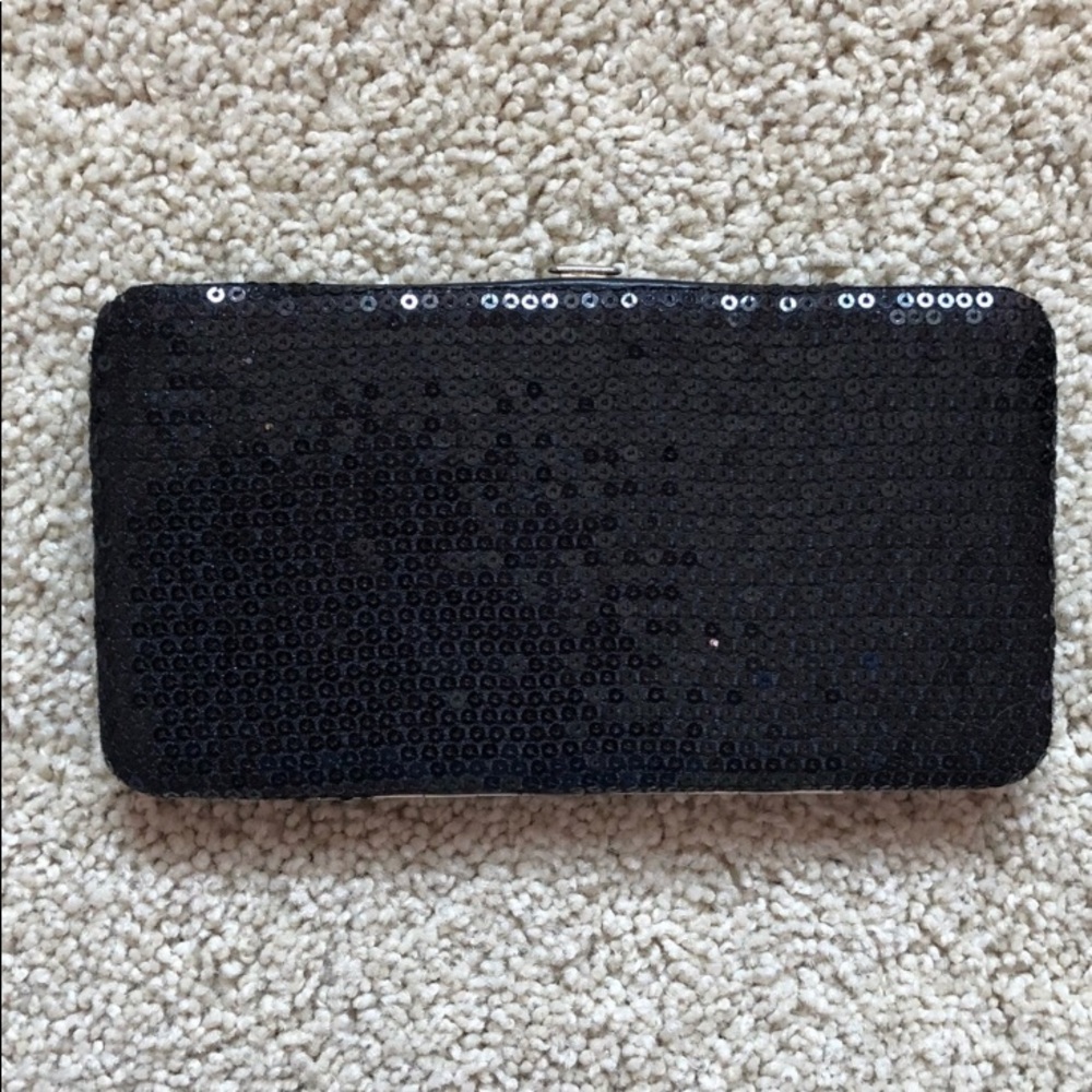Claire’s black sequence evening wallet or bag.